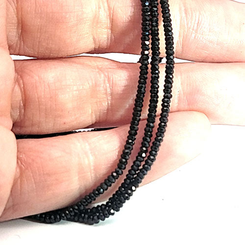 Black spinel, button strand 2 mm faceted