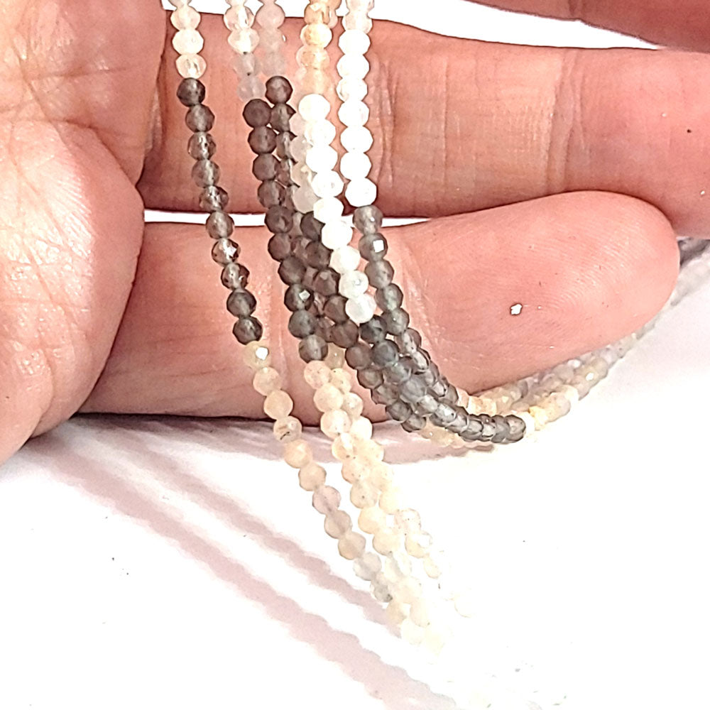 Moonstone multi, spherical strand 2.5 mm faceted