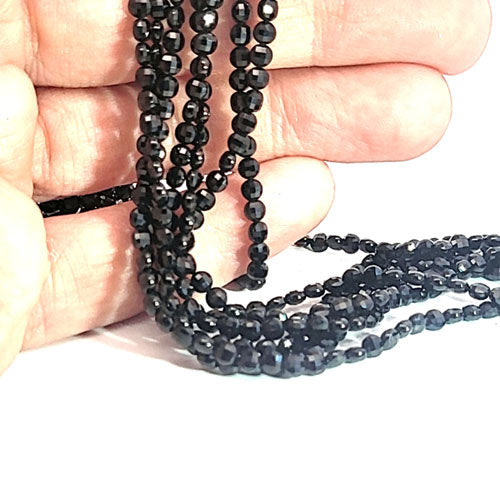 Black spinel, disc strand 3 mm faceted