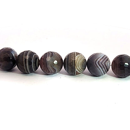 Botswana agate, 14 mm faceted bead strand