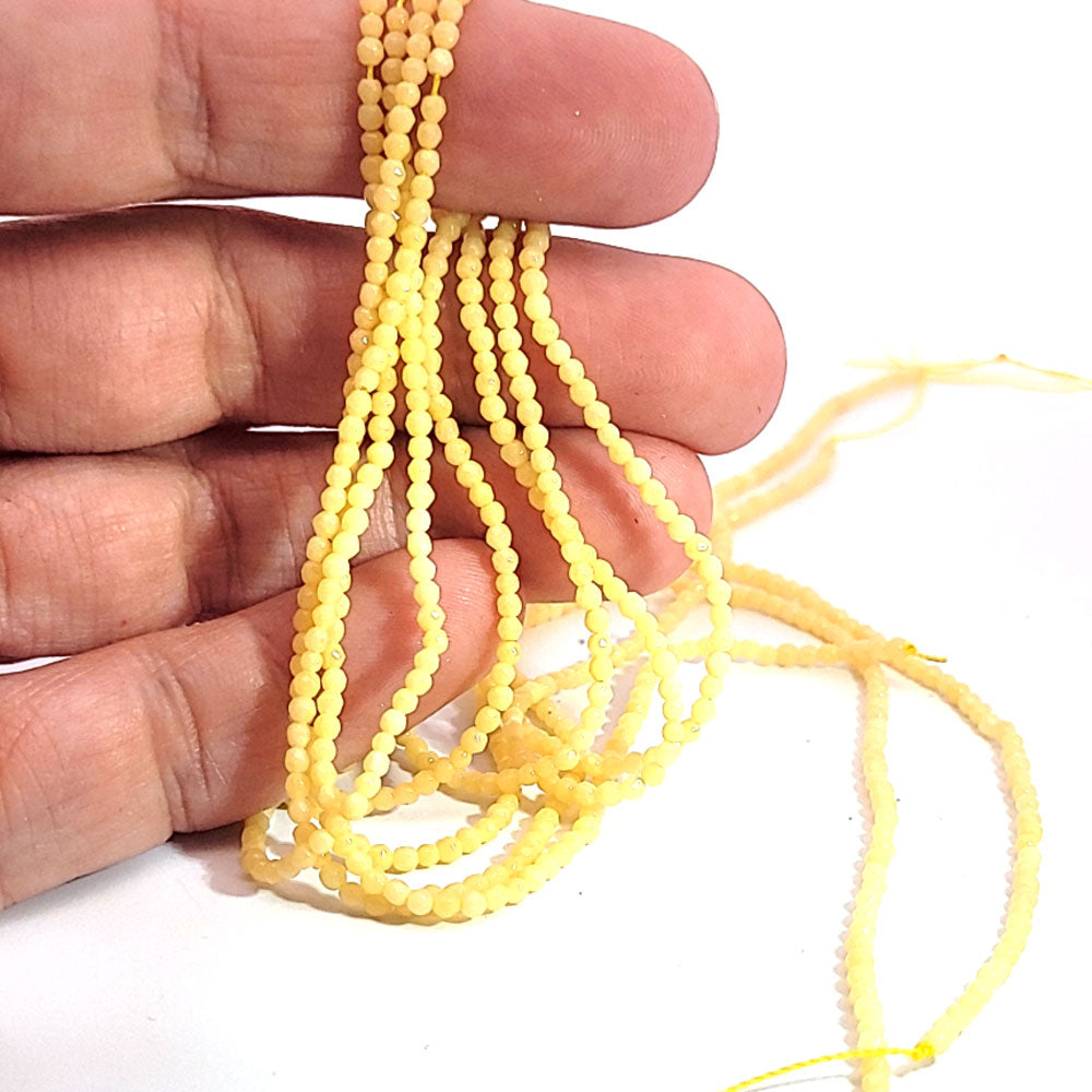 Orange calcite, 2 mm faceted spherical strand