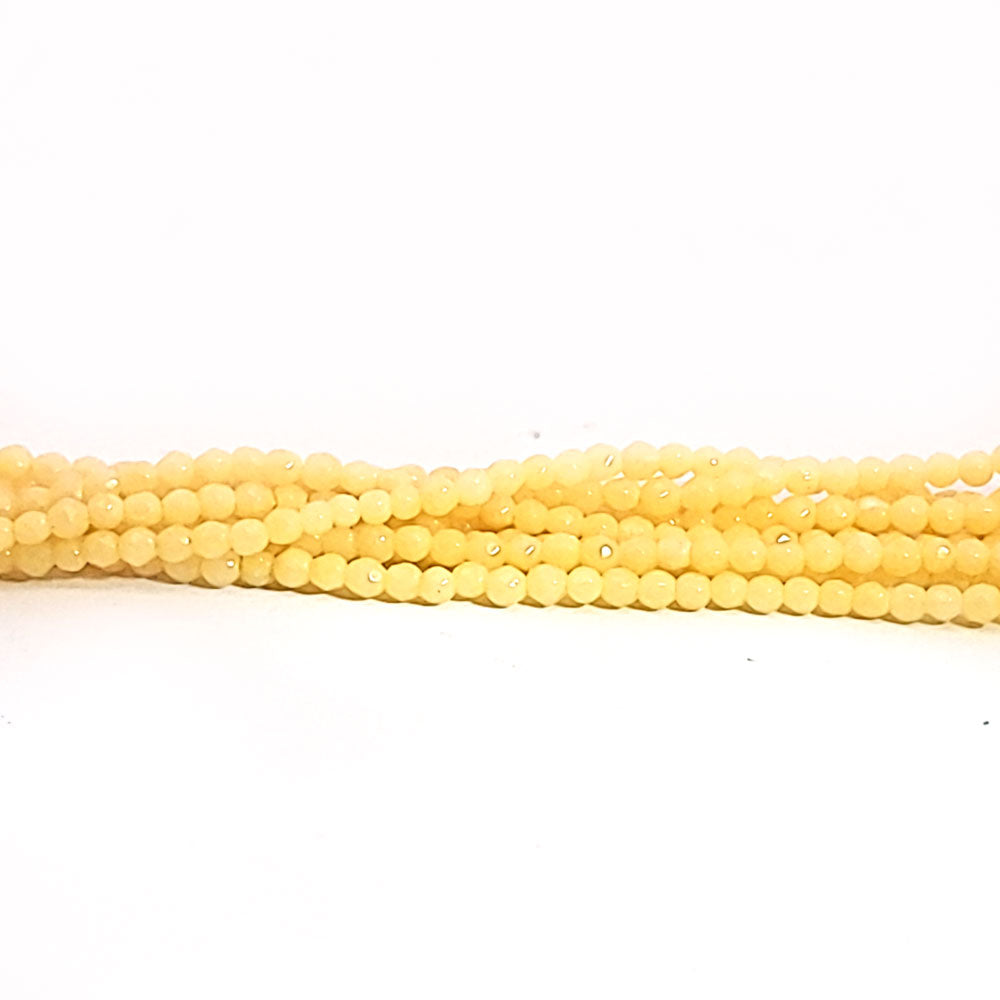 Orange calcite, 2 mm faceted spherical strand