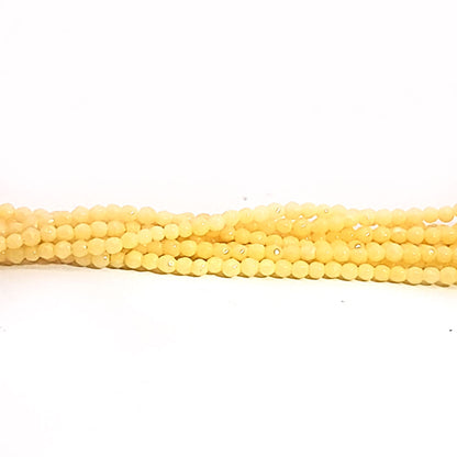 Orange calcite, 2 mm faceted spherical strand